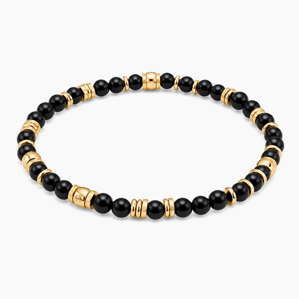 Black Obsidian Wealth Guardian Bracelet - angled view of gold and black obsidian beaded stretch bracelet