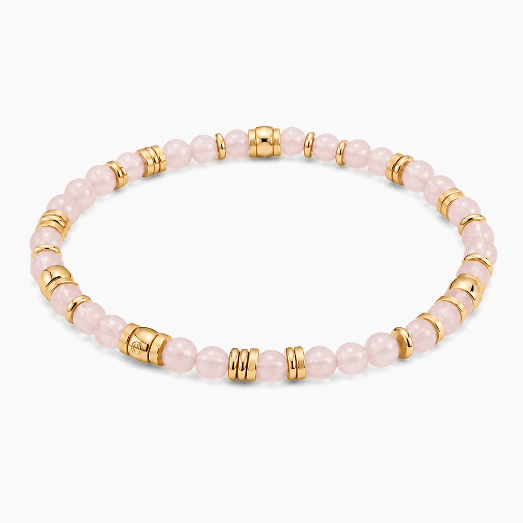 Rose Quartz Abundant Heart Bracelet - angled view of gold and rose quartz beaded stretch bracelet
