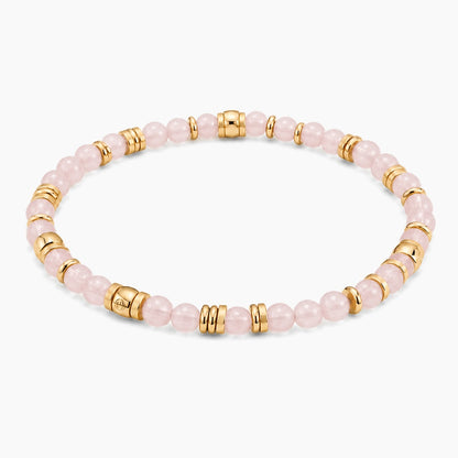 Rose Quartz Abundant Heart Bracelet - angled view of gold and rose quartz beaded stretch bracelet