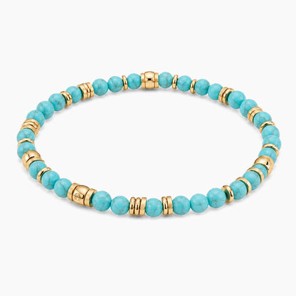 Turquoise Fortune Flow Bracelet - angled view of gold and turquoise beaded stretch bracelet